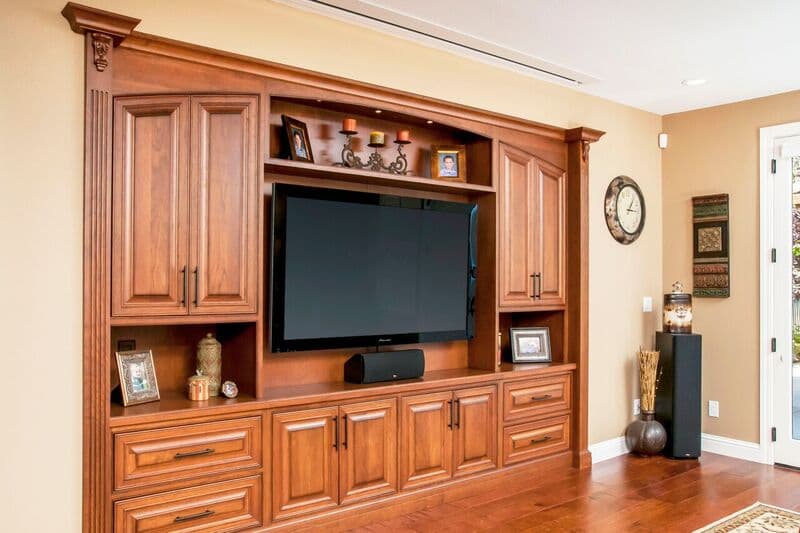 Entertainment Center Cabinetry With A Mid Brown Finish