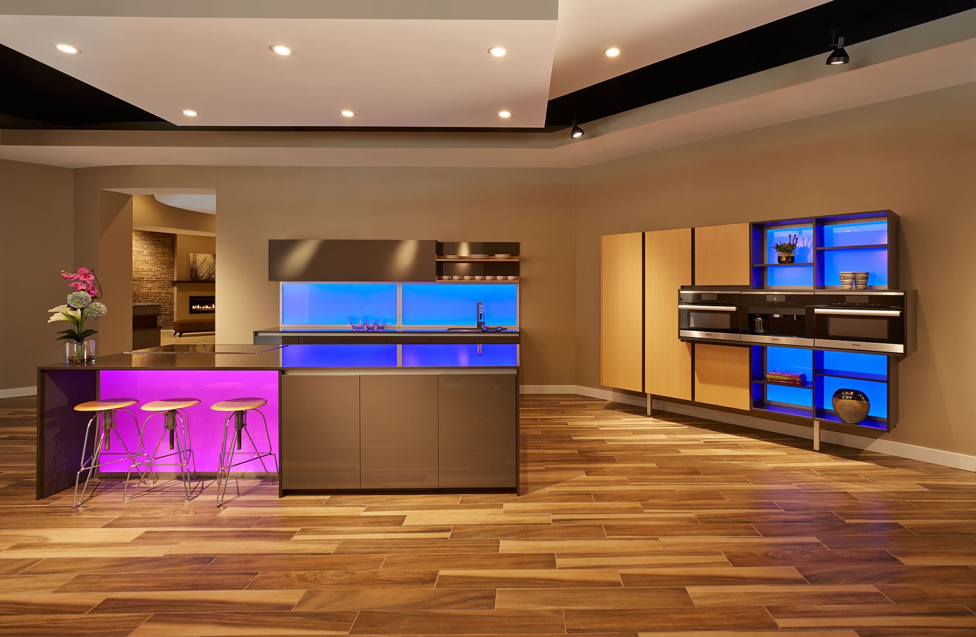 Grey Gloss Cabinetry With A Waterfall Island